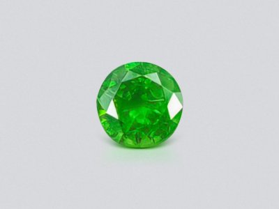 Russian demantoid with horse tail like inclision 0.58 ct photo