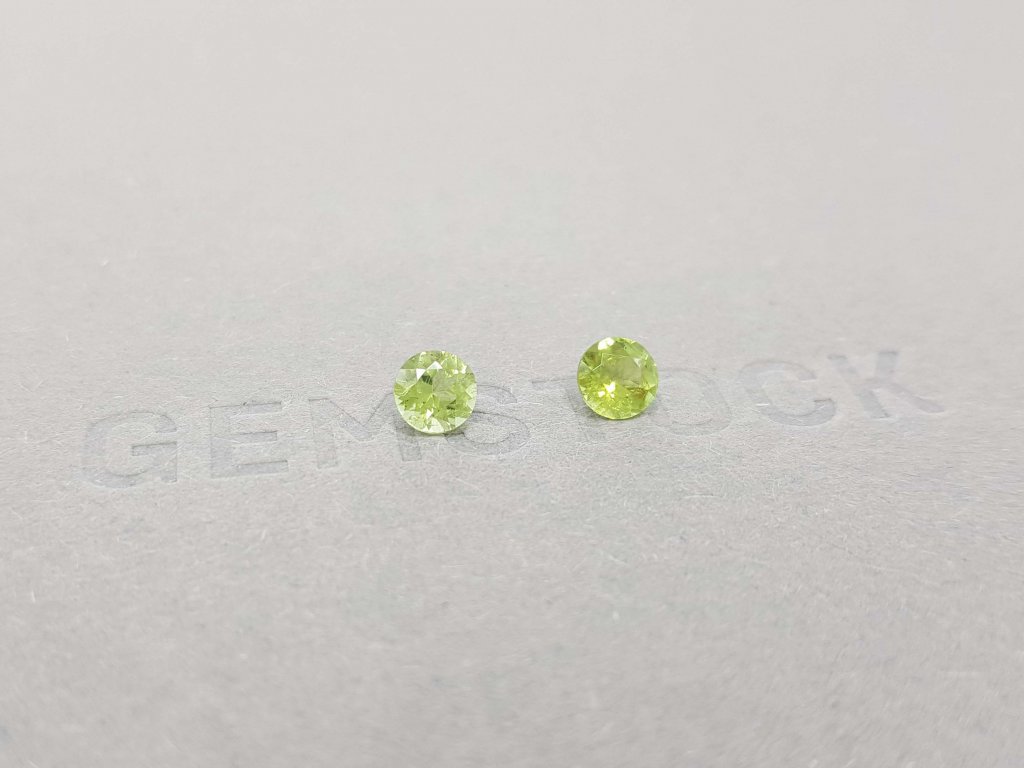 A pair of bright green tourmalines in a 5 mm round cut Image №3