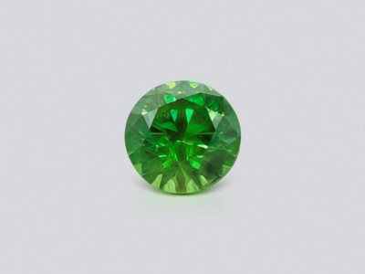 Demantoid in a cut circle 0.85 ct, Ural photo