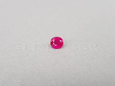 Vibrant pinkish-red ruby from Mozambique in oval cut 2.21 ct photo