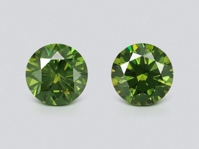 Pair of unique demantoids from Ural mountains in round cut 12.11 carats, GRS photo