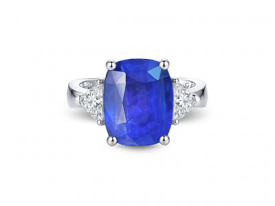 Ring with an unheated intense blue sapphire of 6.43 carats from Sri Lanka and diamonds in 18K white gold. photo